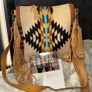 Mercy Grey convertible backpack in full grain leather and Pendleton wool.